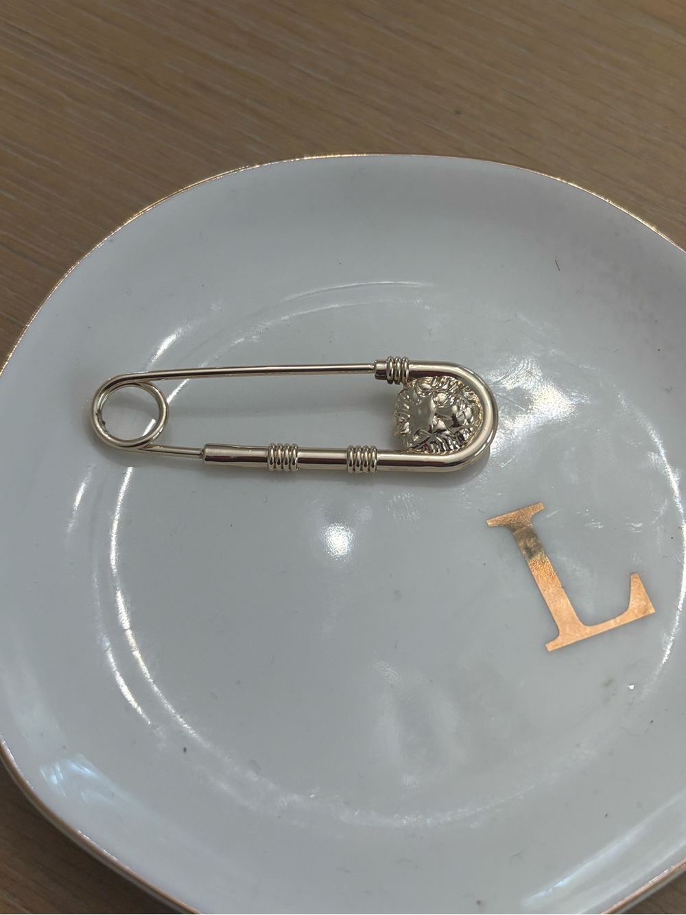 Gold-Tone Safety Pin Brooch with Decorative Medallion